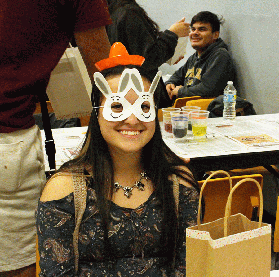 Messing around with the things found in her goody bag, junior Keila Chavez celebrates her last day in Spanish Club. Chavez, along with the rest of the club officers, received goody bags full of Spanish themed gifts. 