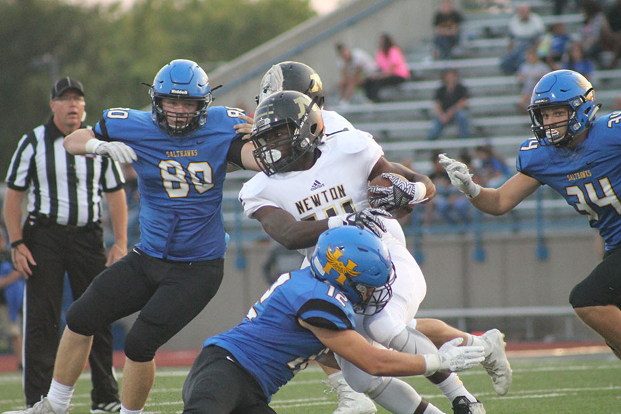 Junior, Isaiah Presley runs the ball at the football game in Hutch on September 8th.