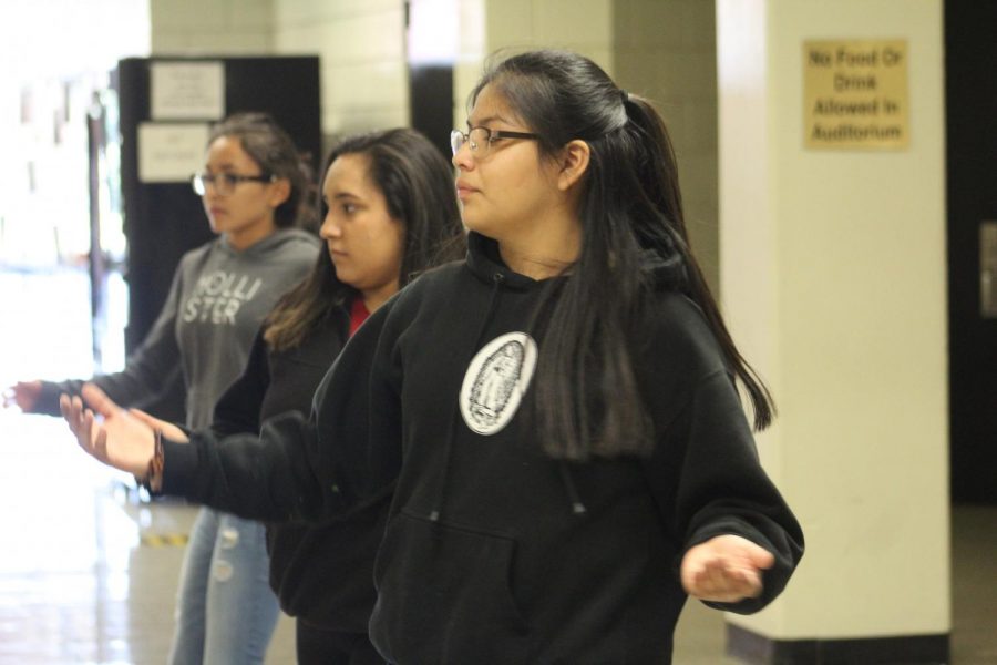 Taking the lead, freshman Jamilid Romero walks with her group taking advice from their adviser Patrice Olias. Azteca members practiced throughout the week to perform at Taste of Newton.