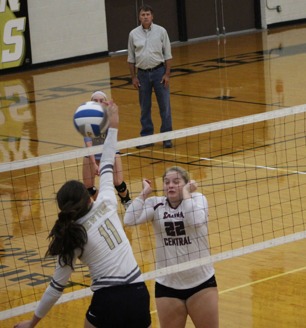 Junior Maggie Remsberg squares up for a spike against Salina Central. Newton won first place over both the Salina Central and Hutch teams.