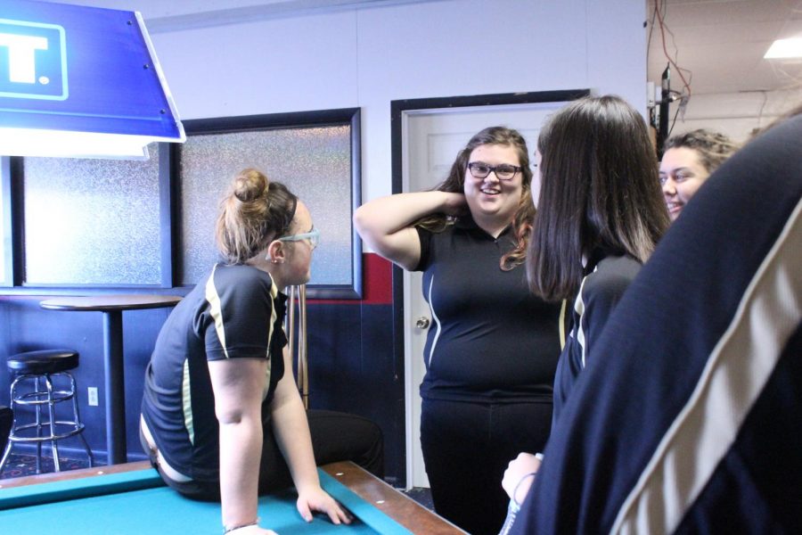 Members of the bowling team hangout before the begging of the meet. The team practices at Play-Mor.