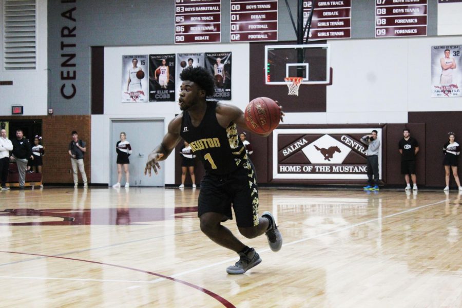 Junior Isaiah Presley drives to the lane during their sub state game against Salina Central. 