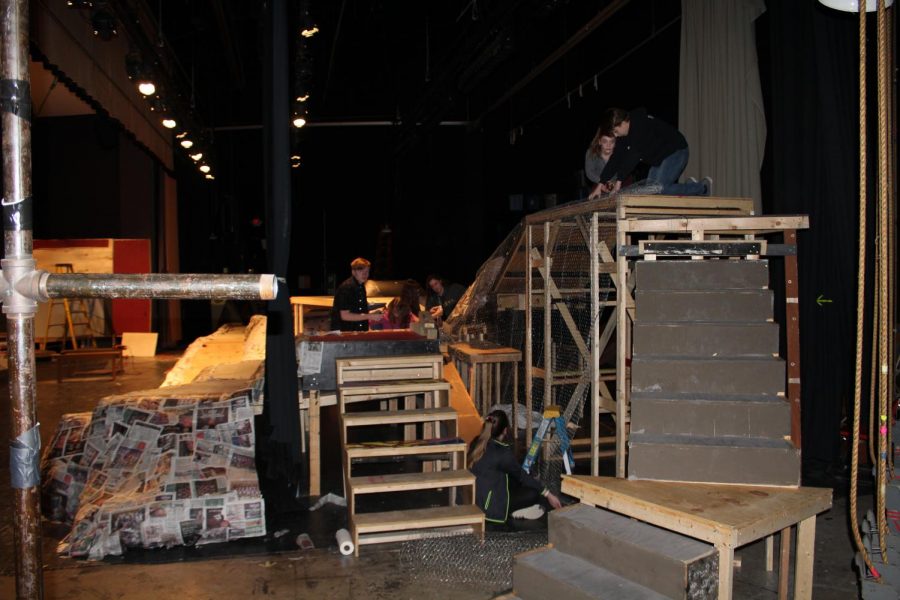 Student from the Technical Theater class work on the set for Brigadoon on Feb. 7. The show would open Feb. 15 and run through the weekend. 