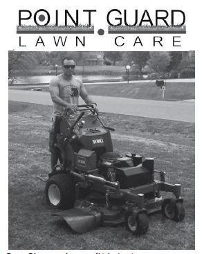 Tommy Edgmon stands on one of his business’ mowers. 
