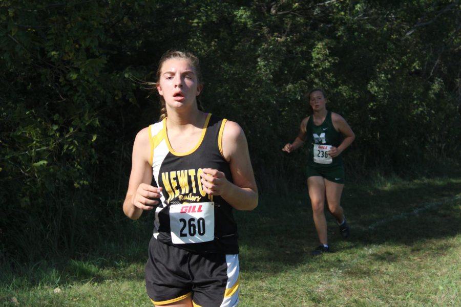 Sophomore Maggee Smith works on breathing while running at Lake Afton