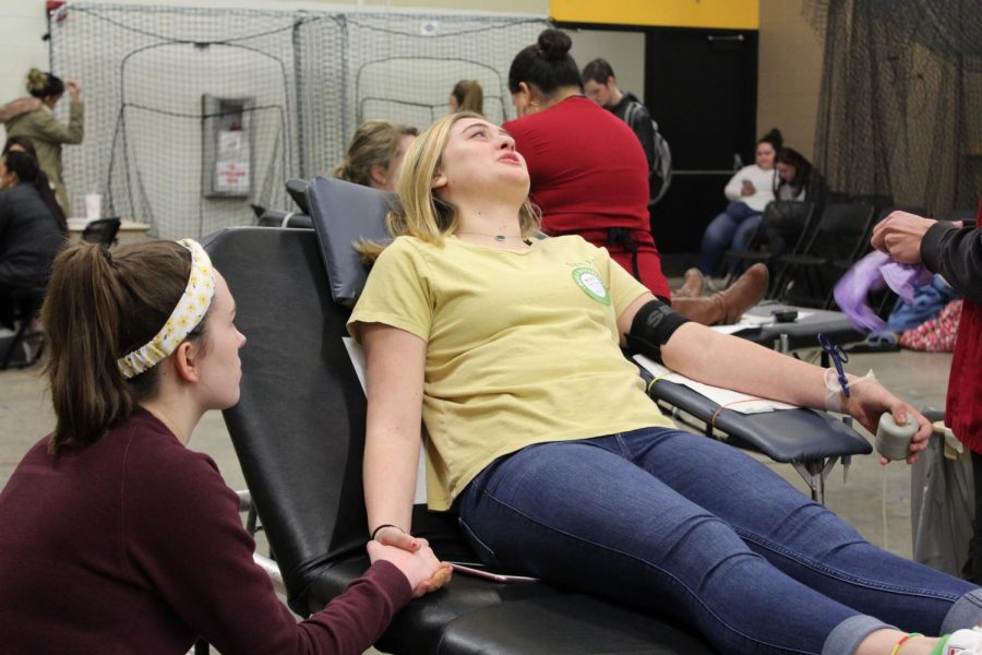 Juniors Chandlor Buffalo gives blood with junior Meya Green alongside for moral support. 