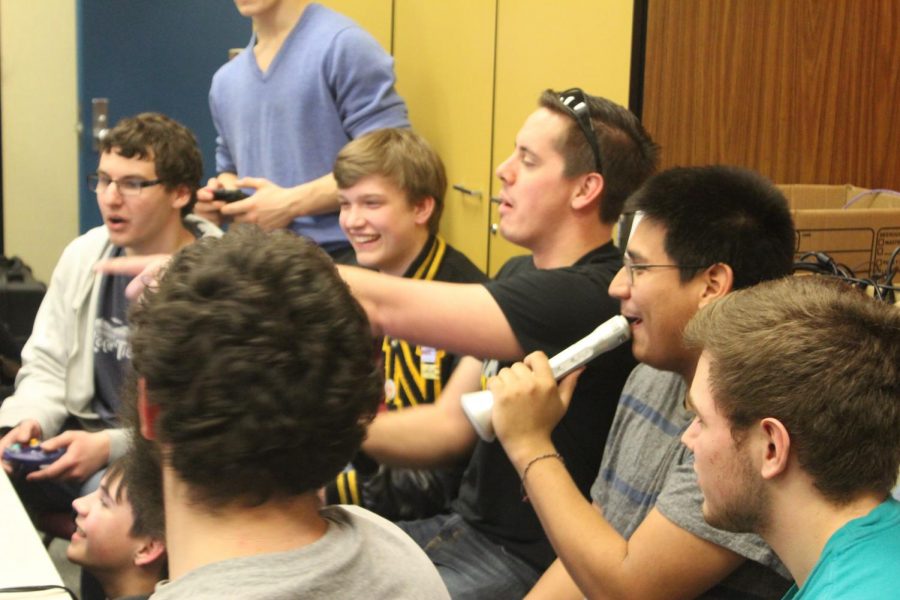 Students participating in a tournament during the first club meeting play Super Smash Bros. Ultimate on the Nintendo Switch.