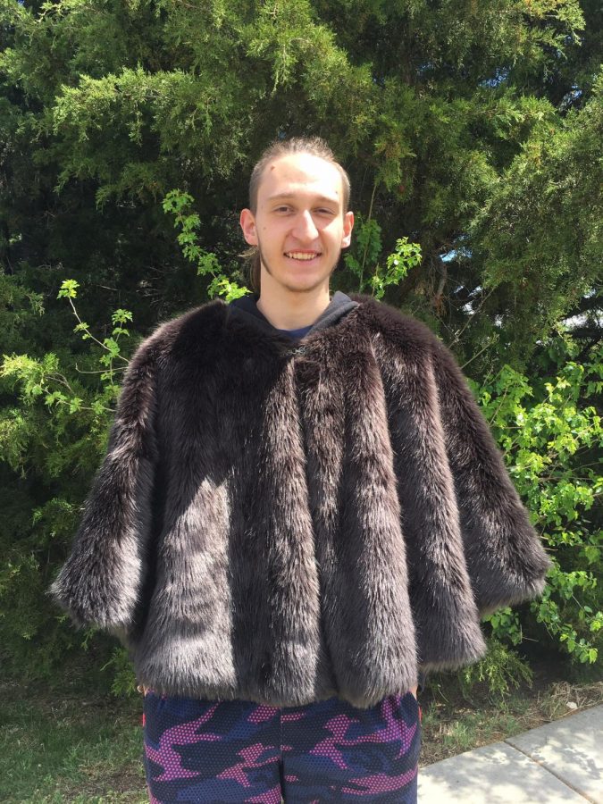 Senior Dominic Ellis shows off his fur used in Asatru traditions, using it as one way to express his religion. Ellis celebrates many holidays surrounding Asatru religion. 
