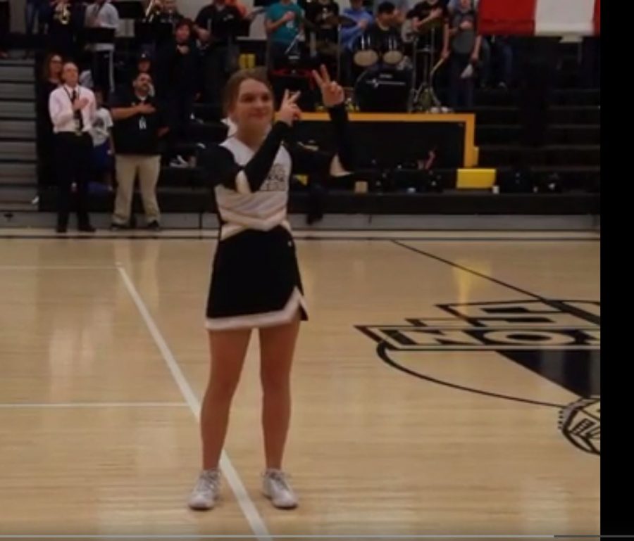 Karly Green signs the National Anthem before the boys varsity basketball game on Jan. 14.