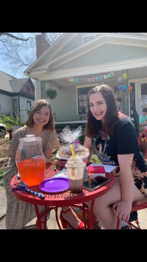 Smiling at the camera, Madyson Groves and Gretchen Otter celebrate around a picnic table for Otters 18th birthday on April 7. Groves also helped in putting together a video and birthday parade for Otter.