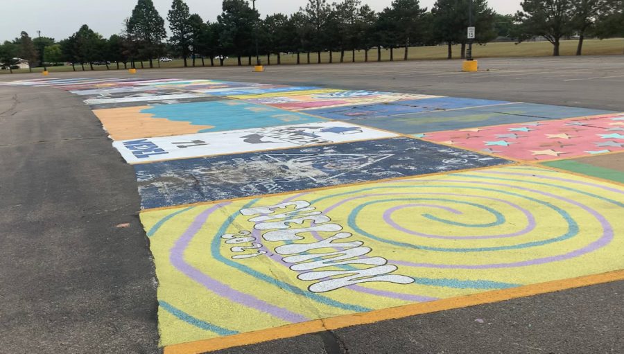 The parking lot is transformed as junior and senior students creatively paint their parking spots. 