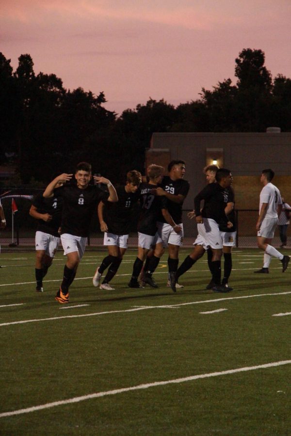 The team celebrates after they score a goal.
