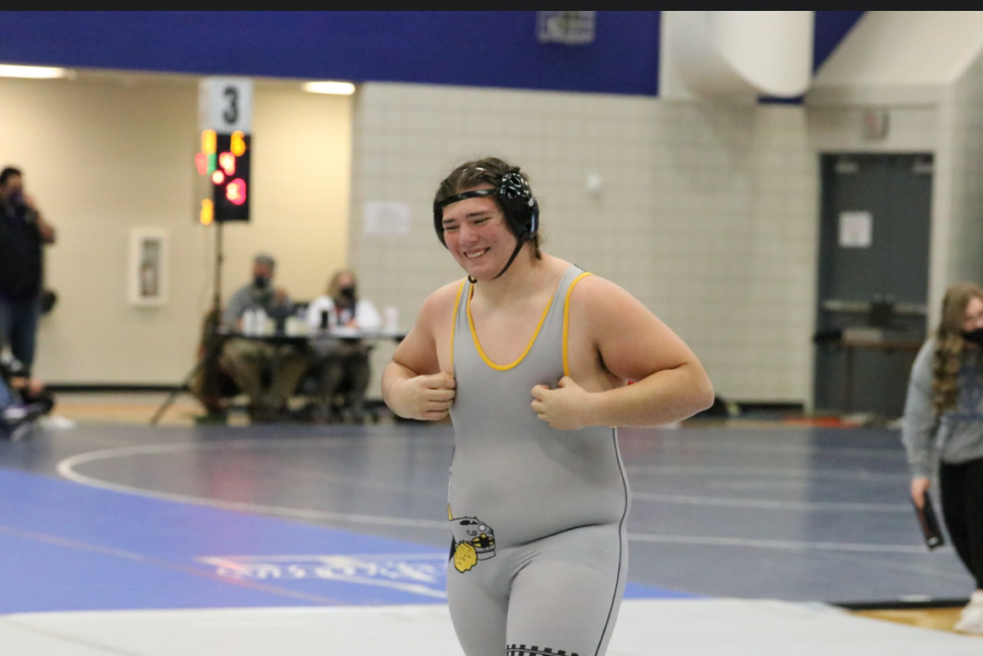 Sophomore Rio Gomez smiles after successfully completing his match.