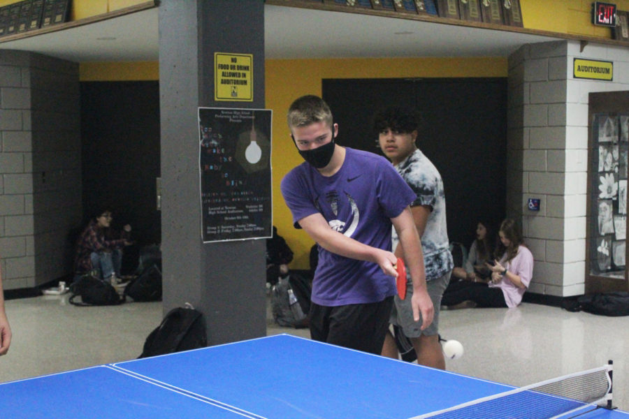 Freshman Trek Wedel hits the ball to his opponent while playing Ping-Pong. 