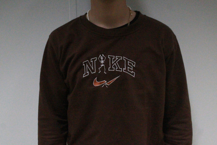 Sophomore+Ian+Baker+wears+one+of+Micks+first+creations%2C+a+handmade+Nike+Skeleton+sweatshirt.