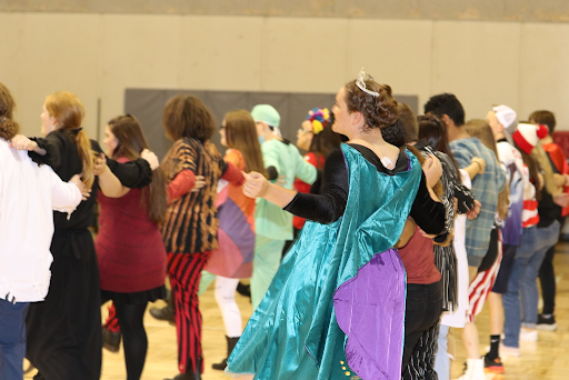 Students entertain the crowd while wearing an array of costumes at the Halloween Gala event.