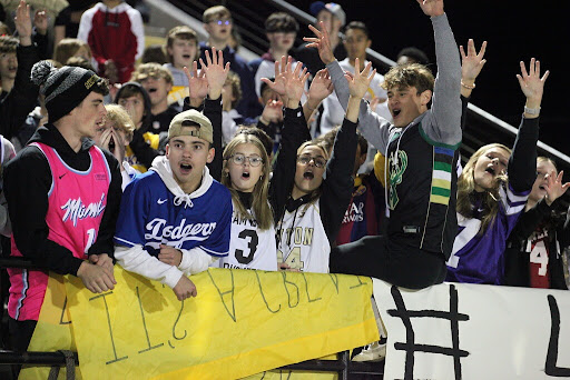 Seniors (left to right) Tanner Dorrell, Cade Valdez, Adeline Tonn, Olivia Adams, Clayton Kaufman and Kamryn Archibald celebrate with the student section during a home football game. 