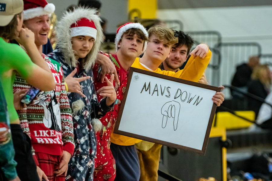 Senior+Jonah+Remsberg+and+fellow+seniors+pose+for+the+camera+while+showing+school+spirit+at+the+Dec.+10+home+basketball+games.