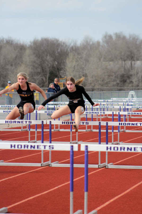 Jumping+over+the+hurdles%2C+sophomore+Berkley+Roberson+competed+in+the+girls+100-meter+race+as+well+as+long+jump%2C+300-meter+hurdles%2C+and+the+4x100