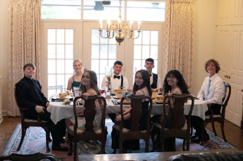 Senior friend group of (left to right) Ethan Sympson, Madelynn Hamm, Olivia Adams, Santiago Castillo, Bryttan Adams, Konner Jaso, Camila Vaquera and Andrew Barron smile at the camera prior to their prom dinner in May 2021.