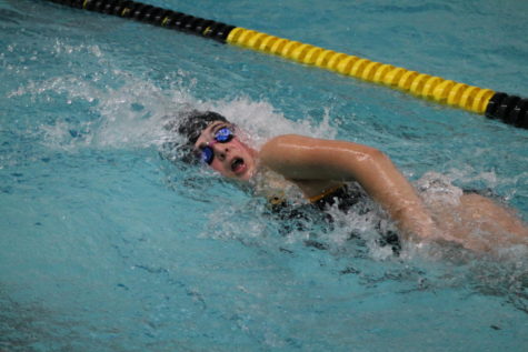 Sophomore Karlyn Archibald swims as the second leg in her 200 yard freestyle relay. 