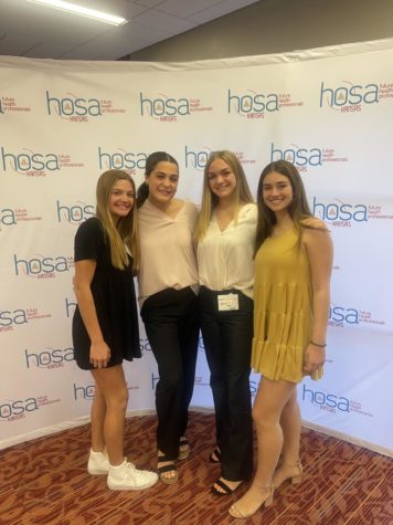 Juniors Emma Huntley, Karlyn Archibald, Lauren Crawford, and Cambri Koehn pose for picture at their HOSA conference.