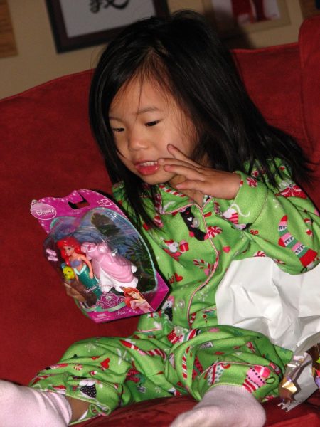 Anna Lakey as a little girl enjoying her Christmas gift in 2009.