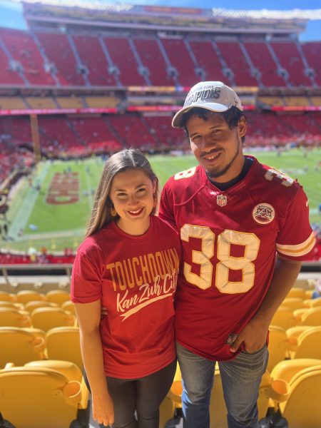 Madeleine Riley and Chase Camarena enjoy their time together at a KC Cheifs Game