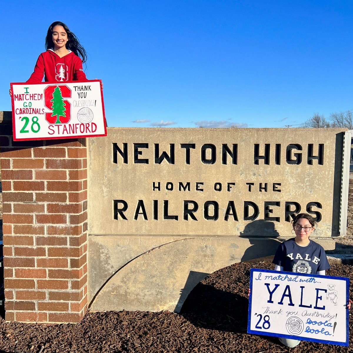 Seniors+Natalie+%28top+left%29+and+Anahi+Sanchez+%28bottom+right%29+pose+with+handmade+posters+outside+of+Newton+High+School+to+celebrate+their+college+acceptances.