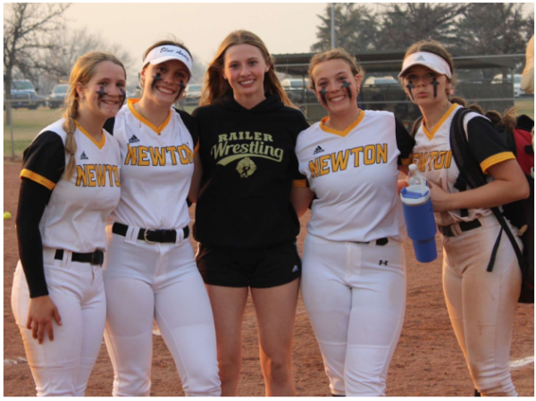 Freshmen, Kalleigh Davis, Gracie Newhouse, Brynn Budde, Chaylee Nash, and Pozzi Krehbiel pose for a picture after a softball game. 
