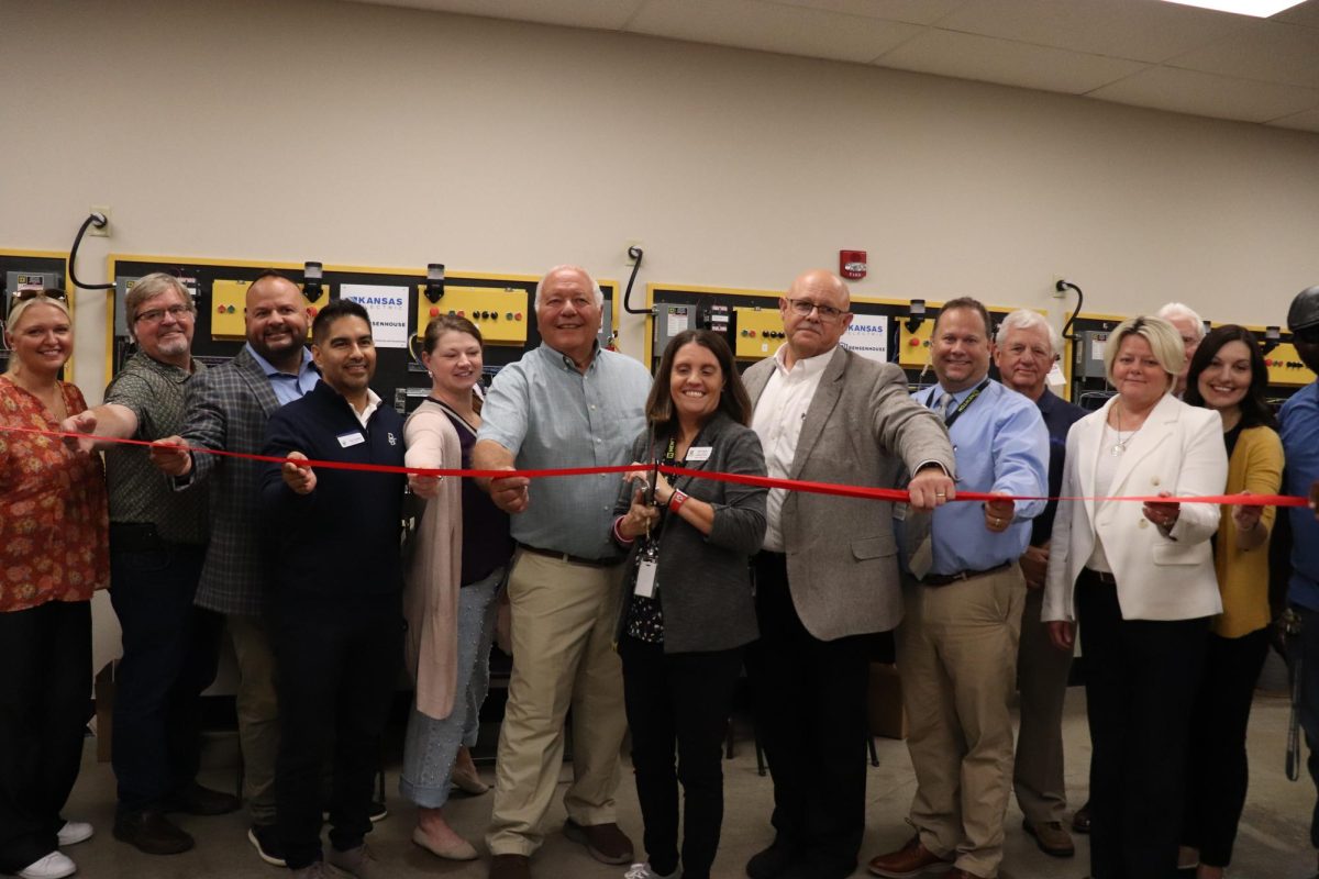 The CTE staff of Newton High School and Hutch Community College officially cut the ribbon of the start of the new electrical program.