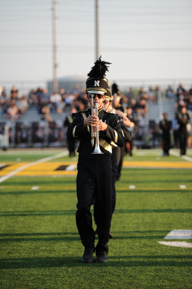 Senior Oliver Smith marches Sept. 13 at the Railer vs Andover Central game.