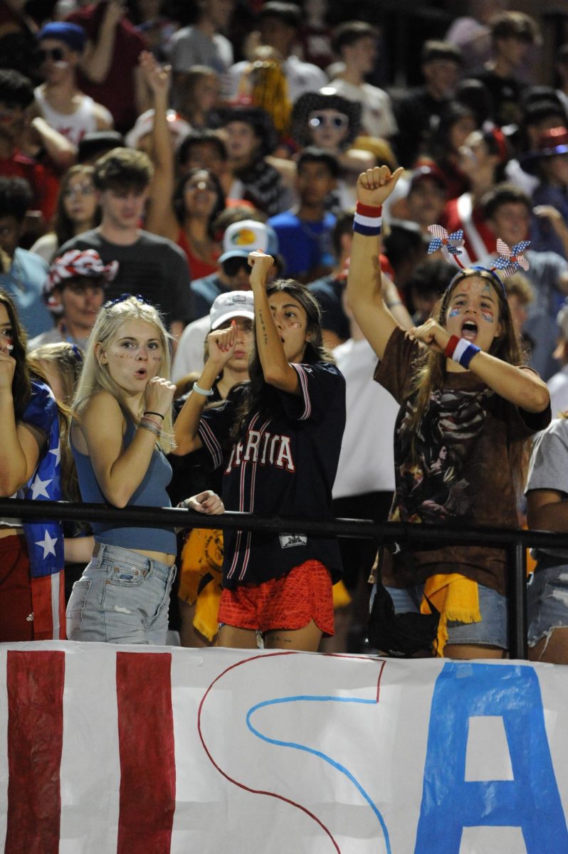 Seniors Devyn Porter, Anaí Fernandez, and Ani Koontz show their Railer pride at the football home game.