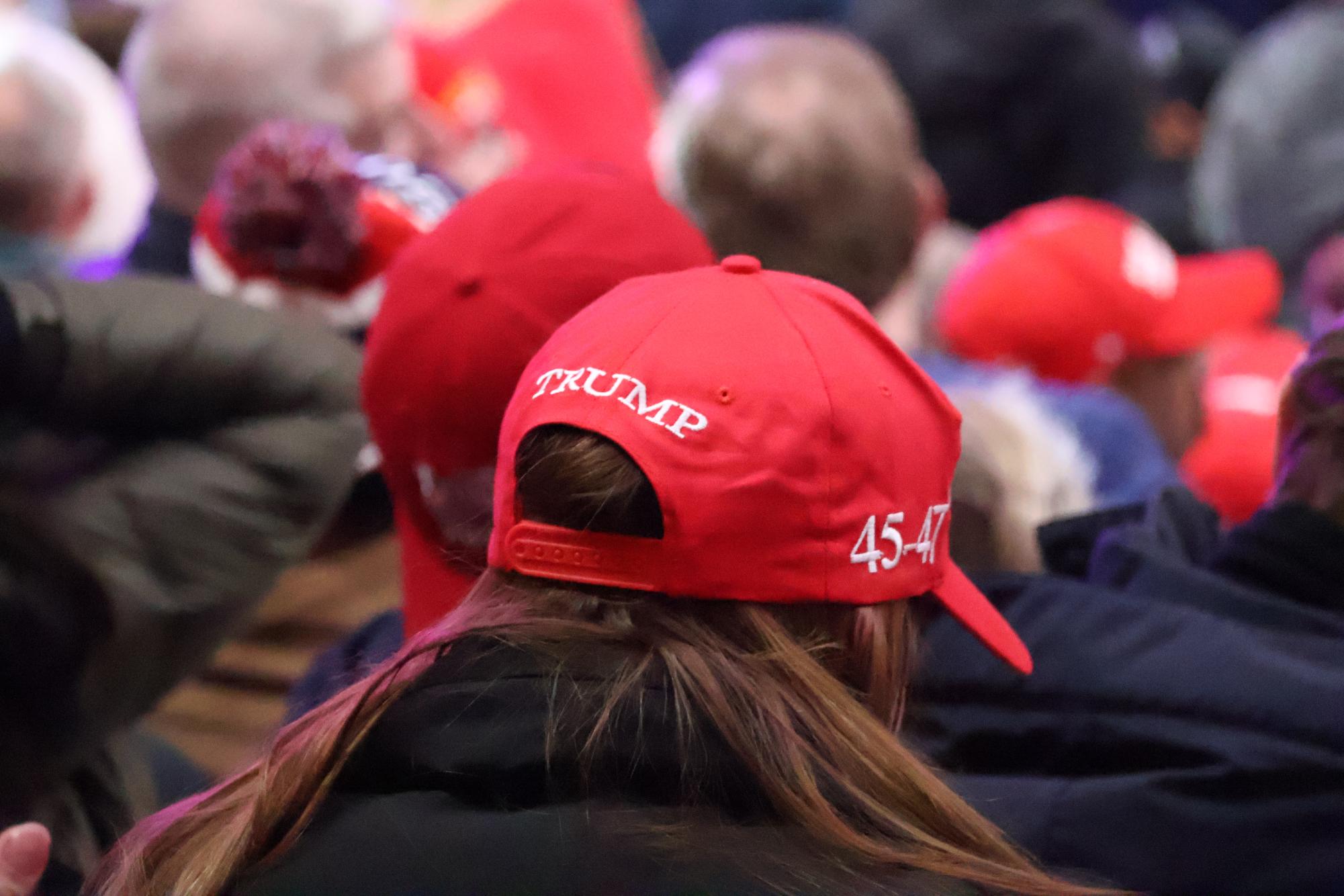  A Trump supporter sits in Capital One Arena viewing the Presidential Inauguration. More than 20,000 people were able to view the event. 