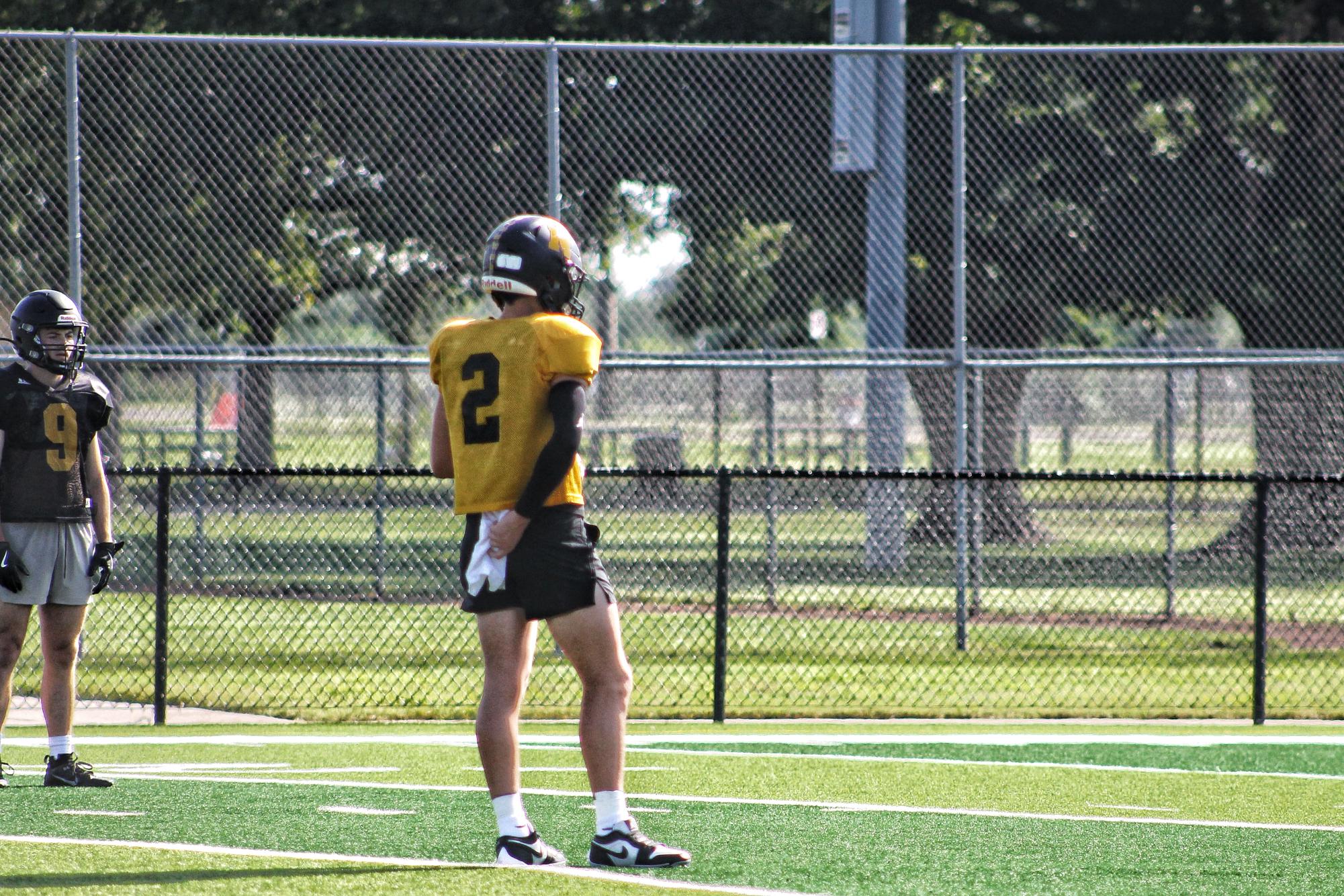 Senior Kolbie Espada prepares to call a play at practice. 